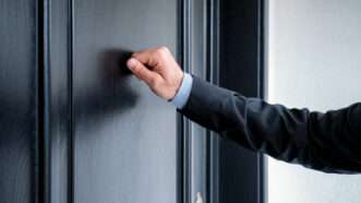 Close-up of a man's hand knocking on a door. | Rangizzz | Dreamstime.com