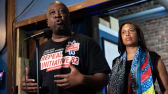 Shawn Townsend, president and CEO of the Restaurant Association of Metropolitan Washington, and Mayor Muriel Bowser conduct a news conference after a roundtable about the repeal of Initiative 82 which eliminated the tipped minimum wage. | Tom Williams/CQ Roll Call/Newscom