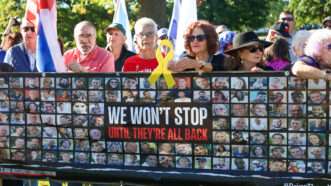 Protesters holding a sign with Israeli hostages on it | Robyn Stevens Brody/Sipa USA/Newscom
