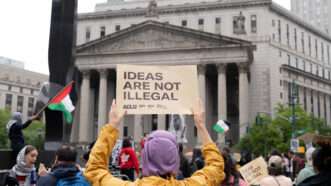A protester holds a placard reading ''Ideas Are Not Illegal'' in support of Tufts University student Rumeysa Ozturk and Columbia University student activist Mohsen Mahdawi outside of the United States Court of Appeals for the Second Circuit in New York City on May 6, 2025. | Derek French/ZUMAPRESS/Newscom