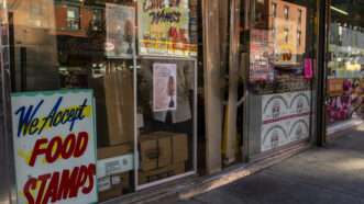 A sign saying "We accept food stamps" outside a grocery store | John Marshall Mantel/ZUMAPRESS/Newscom