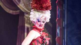 Drag show performer | Photo by <a href="https://unsplash.com/@jeztimms?utm_source=unsplash&utm_medium=referral&utm_content=creditCopyText">Jez Timms</a> on <a href="https://unsplash.com/photos/woman-wears-red-tank-dress-UrjJDU7tHX8?utm_source=unsplash&utm_medium=referral&utm_content=creditCopyText">Unsplash</a>       