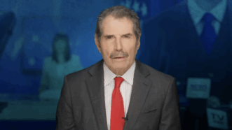 John Stossel is seen in front of a tableau of journalists | Stossel TV