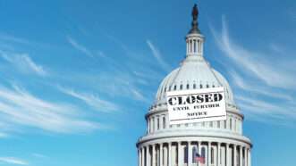 The U.S. Capitol against a blue sky. A sign draped around the Capitol dome says "Closed Until Further Notice." | Rickk6rj | Dreamstime.com