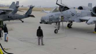 An aircraft mechanic works on an A-10 Thunderbolt at the "Boneyard" for retired aircraft on Davis-Monthan AIr Force Base, Arizona. February 12, 2025. | U.S. Marine Corps photo by Cpl. Joshua Munsen