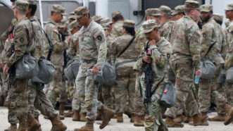Members of the Texas National Guard assemble at the Army Reserve Training Center in Elwood, Illinois | Brian Cassella/TNS/Newscom