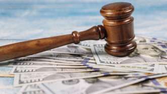 Court gavel and money | ID 156684071 © Photovs | Dreamstime.com