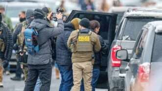 Federal agents making an immigration arrest | Holden Smith/ZUMAPRESS/Newscom