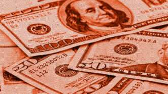 US Dollars tinted red | Photo: PedaltotheStock/Envato