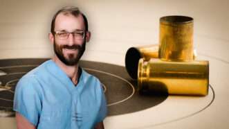 Alex Pretti against a background of a shootiing target with shell casings on top of it | Robert Aubin/Dreamstime/Wikimedia Commons