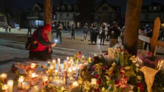 Mourners leave candles and cards after Minneapolis ICE shooting | Angel Colmenares/EFE/Newscom