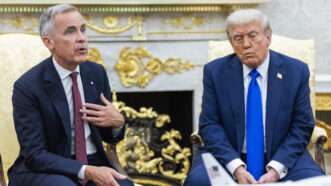 Mark Carney and Donald Trump sitting in the White House | CNP/AdMedia/Newscom