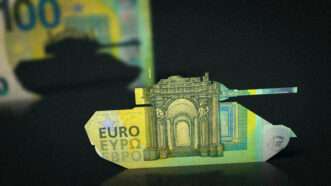 A Euro note folded into the shape of a tank. | Kontakt5956/Dreamstime