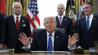President Donald Trump, joined by Roger Penske, Chair of the Penske Corporation, Bud Denker, President of Penske Corporation, and U.S. Interior Secretary Doug Burgum, delivers remarks before signing an executive order in the Oval Office | Sipa USA/Newscom
