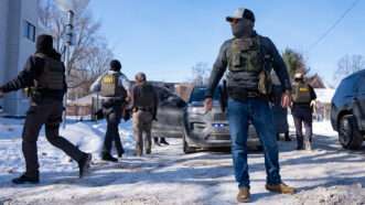 A group of federal agents walking around a snow street | Photo: ICE agents in Minneapolis, February 3, 2026; Alex Kormann/The Minnesota Star Tribune via Getty Images