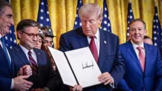 President Donald Trump holds up an executive order he has just signed, in February 2026. | Shawn Thew - Pool via CNP/CNP / Polaris/Newscom