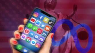 Hand holding an iPhone showing social media apps, with Lady Justice in the background | IMAGO/Frank Hoermann / SVEN SIMON/IMAGO/Sven Simon/Newscom