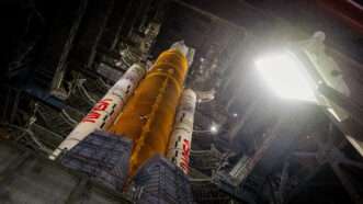 NASA's Artemis II Space Launch System rocket and Orion spacecraft are pictured from below, rising up at a diagonal angle. | IMAGO/Joel Kowsky / NASA via CNP /MediaPunch/IMAGO/MediaPunch/Newscom