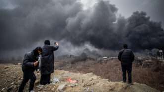 Plumes of smoke rise over the oil depot tanks hit by joint Israel-U.S. overnight in a station northwest of the capital in Tehran in Iran on Sunday, March 8, 2026. | str/UPI/Newscom