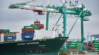 Cargo ship at port with containers | Ian L. Sitren/ZUMAPRESS/Newscom