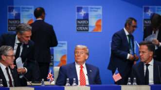 President Donald Trump sits alone among world leaders at a NATO meeting. | Beata Zawrzel/ZUMAPRESS/Newscom