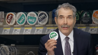 John Stossel holds a Zyn container | Stossel TV