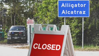 A 'closed' sign in front of 'Alligator Alcatraz' | Dave Decker/ZUMAPRESS/Newscom/Envato