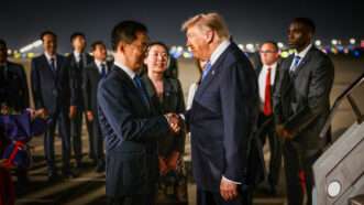 U.S. President Donald Trump greets Chinese Vice President Han Zheng at Beijing International Airport on May 13, 2026. | THE WHITE HOUSE/UPI/Newscom