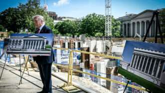 President Donald Trump displays pictures of the White House ballroom project | Joyce N. Boghosian/Newscom
