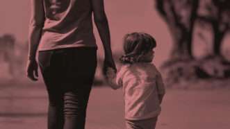 A mother holding the hand of her child | Princeton University Press
