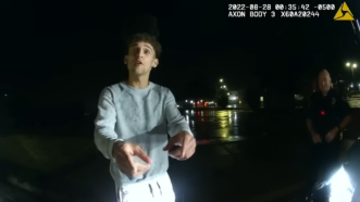 Screenshot from police body camera footage showing a man in pointing at the cop wearing the body camera | Body camera footage