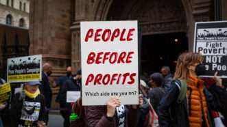 'People Before Profits' protest sign | Gina M Randazzo/ZUMAPRESS/Newscom