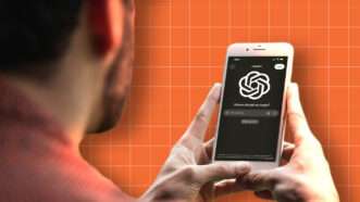 Man on iPhone looking at ChatGPT | Adani Samat/Envato