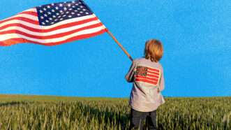 Young kid waving an American flag in a field | Envato