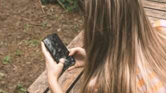 A teenager using a smartphone | Konrad Nowacki/Unsplash