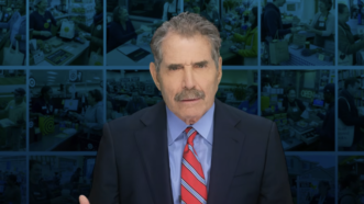 John Stossel stands in front of photos of people conducting business transactions | Stossel TV