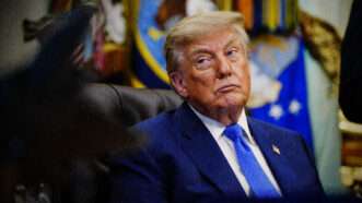 A photograph of President Donald Trump sitting down. | Photo: Bonnie Cash - Pool via CNP/CNP/Polaris/Newscom