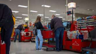 Shoppers use a self checkout at Target. | ColleenMichaels/Dreamstime