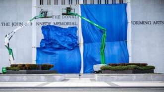 Construction lifts and tarps partially obscuring the Kennedy Center | Photo: Jim Watson/AFP/Getty Images