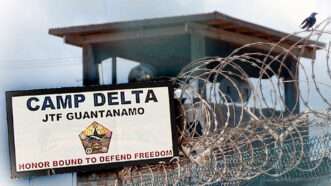 Guantanamo Bay detention center sign and barb wire fence | Photo: Wiki Commons.