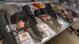 pistols displayed at a gun shop | Jesse Paul/Zuma Press/Newscom