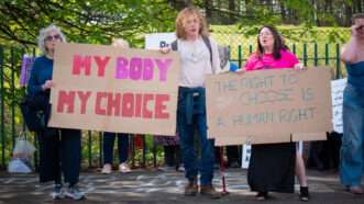 Pro-choice demonstrators with signs | Photo: Cameron Scott/ZUMAPRESS/Newscom
