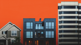 An orange background with different examples of housing types across it | Noah Strycker/Dreamstime/vad_7/18blackhunter822/rawpixel.com/Magnific/Mariam Zakaidze