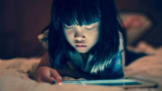 A child using a tablet | Vinnstock/Dreamstime