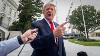 Trump speaks to a reporter | Ron Sachs - Pool via CNP/CNP / Polaris/Newscom