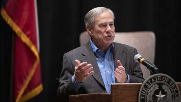 Texas Governor Greg Abbott speaks next to the American flag | Bob Daemmrich/Zuma Press/Newscom