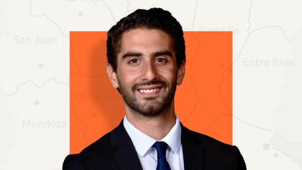 Marcus Falcone in front of orange square background | Lex Villena