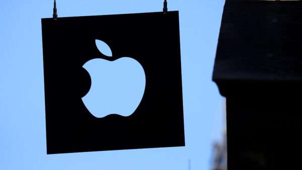 Apple logo hangs outside of retail store | John Angelillo/UPI/Newscom