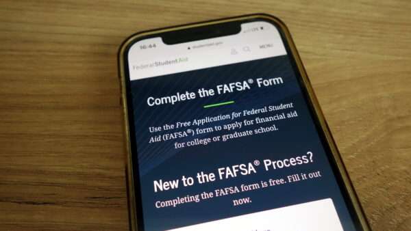 A smartphone showing the FAFSA form | Photo 220871921 © Piotr Swat | Dreamstime.com