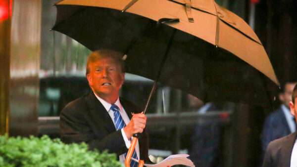Donald Trump holding an umbrella | MEGA / Newscom/JDNEW/Newscom